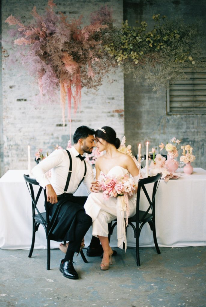 Couple sitting by reception table 