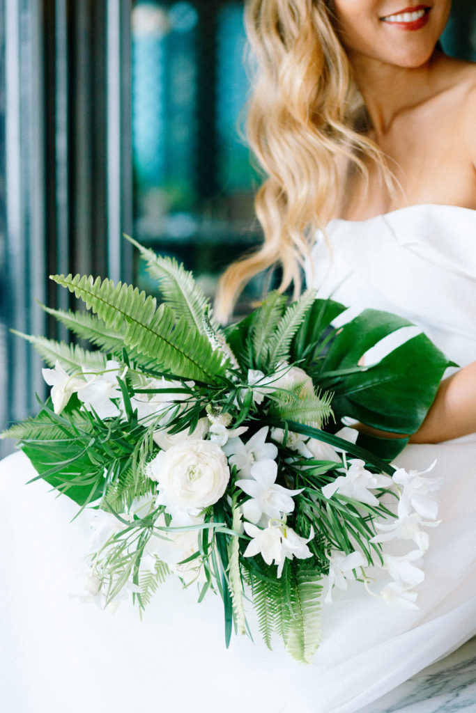 Bride holding bouquet by August and Sage