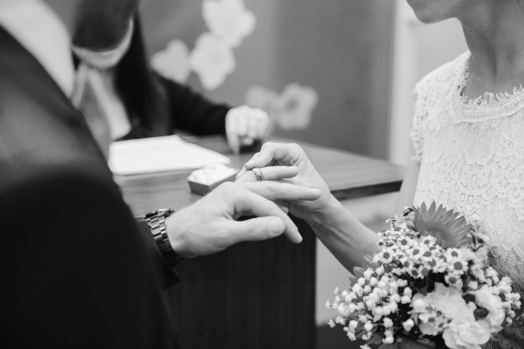New York couple exchanging rings during the marriage ceremony